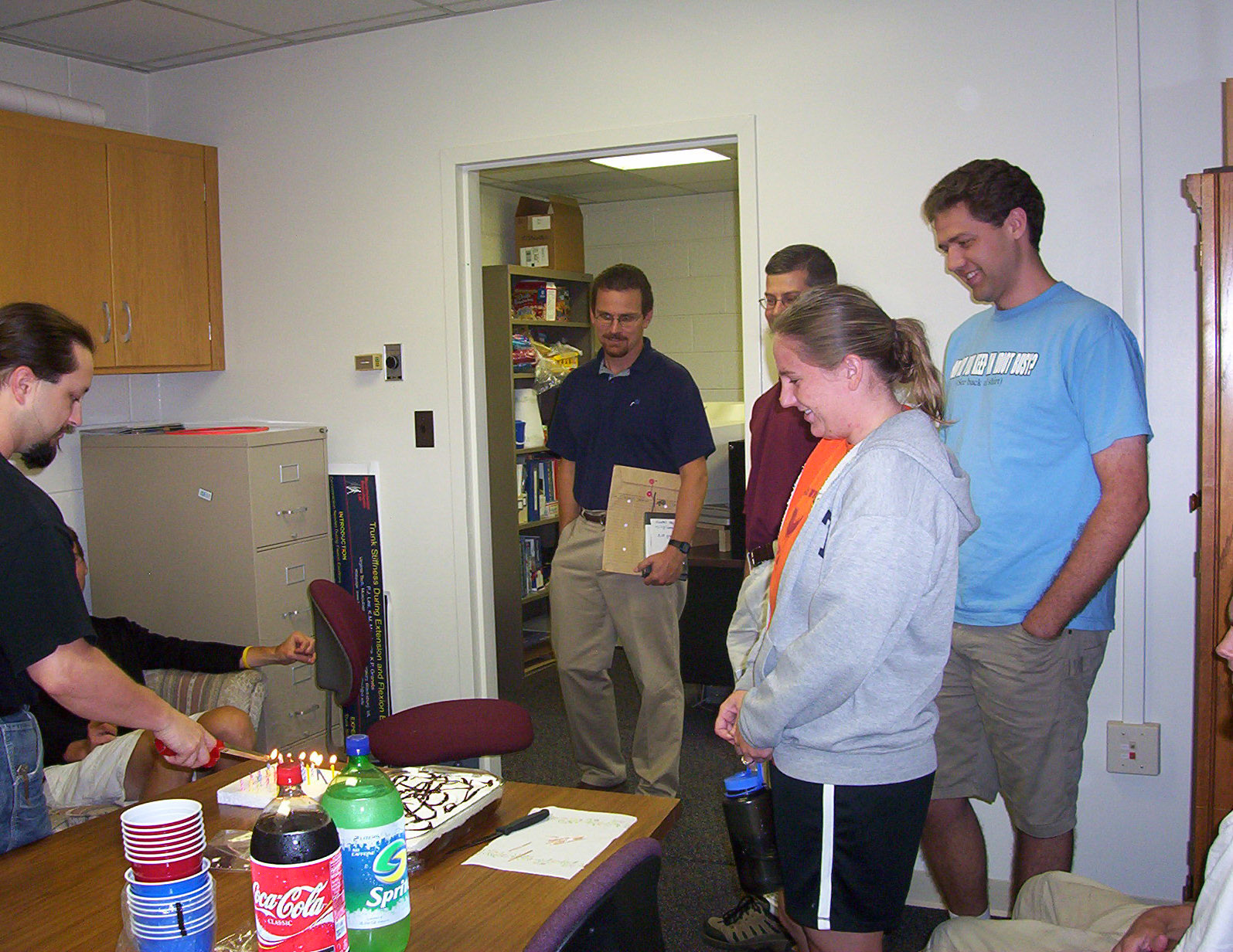 Image of Dr. Kevin Granata and students celebrating a birthday.
